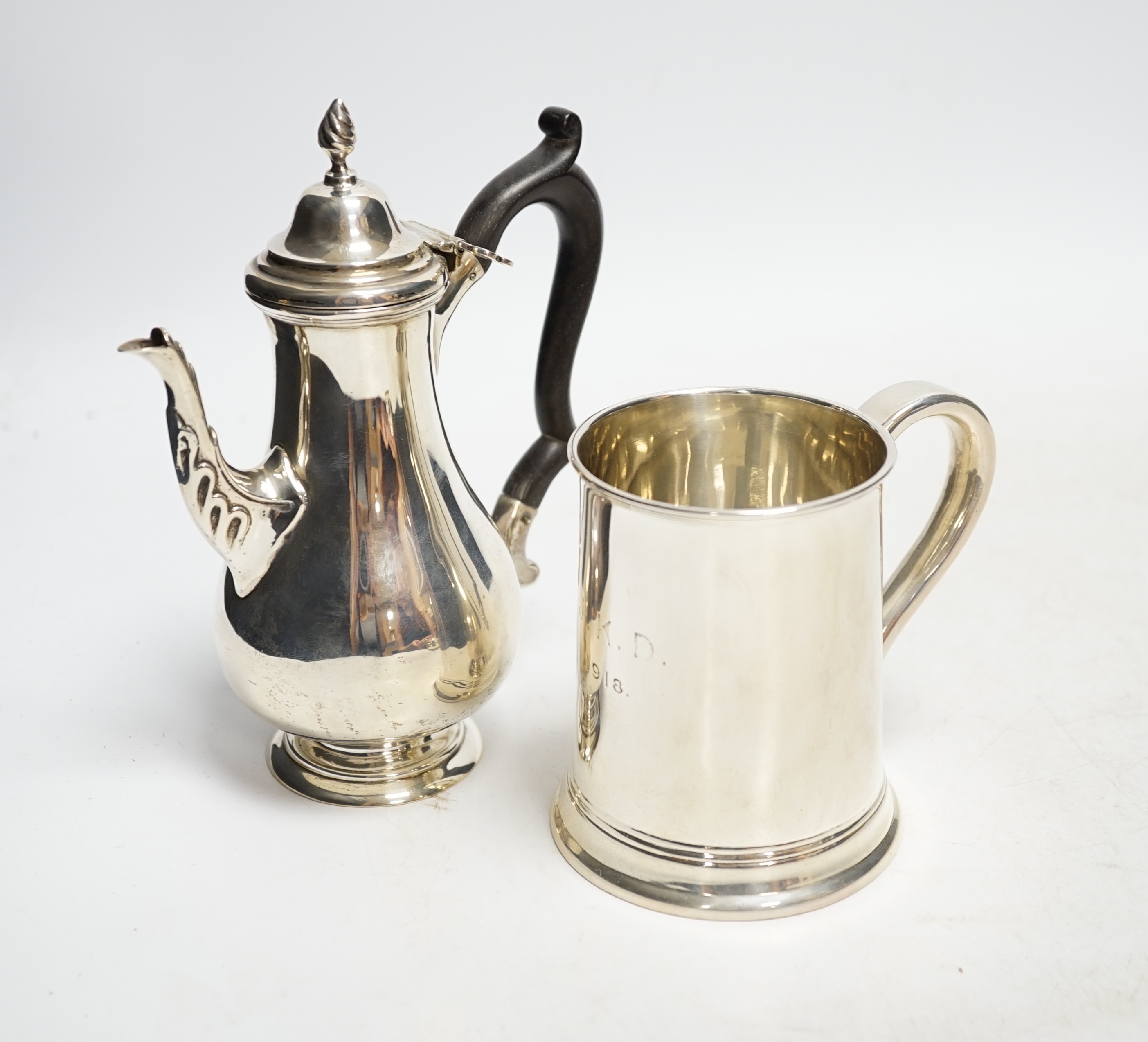 A George V silver mug, by Thomas Bradbury & Sons, 96mm and a silver bachelor's coffee pot, Chester, 1901, weighted. Condition - fair to good